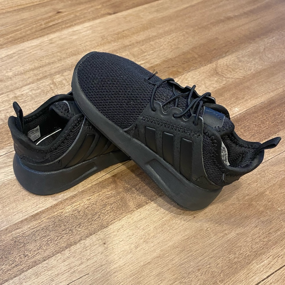 Black adidas toddler sneakers.